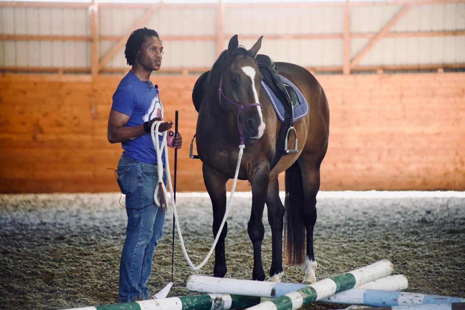 Nahshon Cook working a horse in the arena